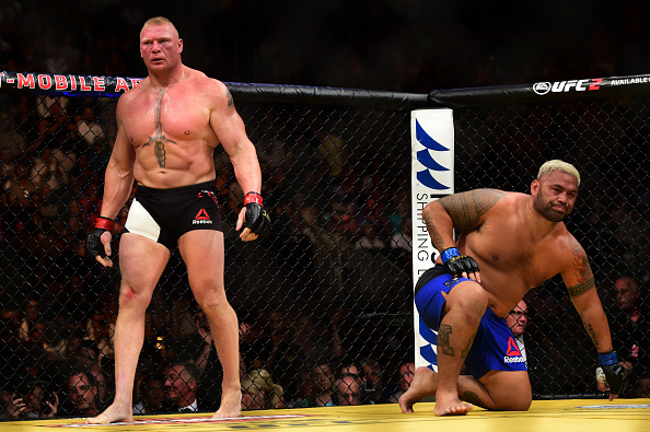 LAS VEGAS, NV - JULY 09: (L-R) Brock Lesnar and Mark Hunt of New Zealand return to their corners after round one in their heavyweight bout during the UFC 200 event on July 9, 2016 at T-Mobile Arena in Las Vegas, Nevada. (Photo by Harry How/Zuffa LLC/Zuffa LLC via Getty Images)