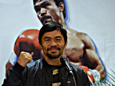 Philippine boxing icon Manny Pacquiao poses for photos during a press conference shortly after arriving at the international airport in Manila on January 24, 2019, days after defeating US boxer Adrien Broner in Las Vegas. (Photo by TED ALJIBE / AFP).